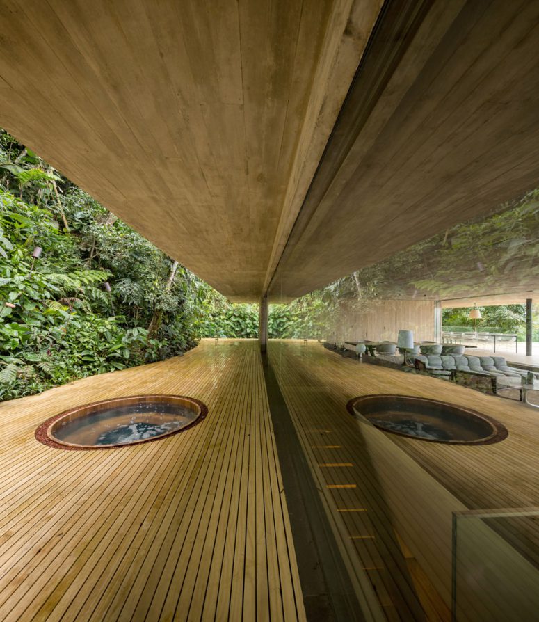 The floor of the living area is a bit sunken to diminish its scale