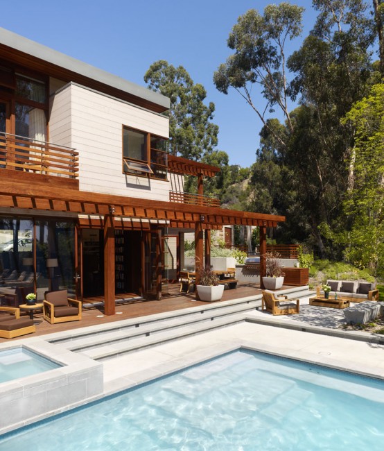 Irregularly Shaped House With A Small Grove Of Eucalyptus And Pine Trees