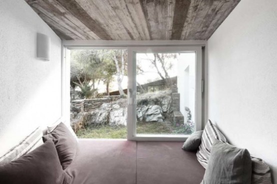 Rustic House With Massive Rock Formations In The Interior