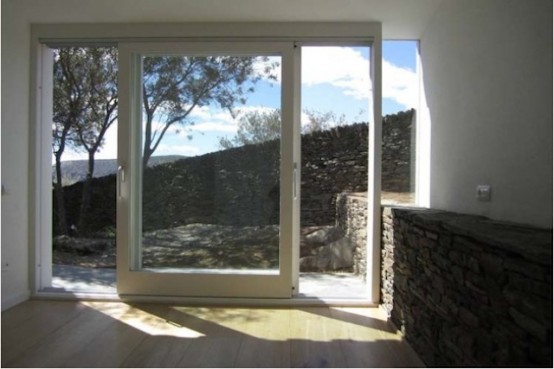 Rustic House With Massive Rock Formations In The Interior