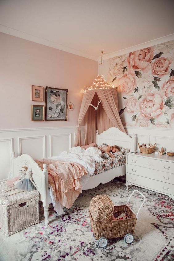 A Beautiful Pink Girls Bedroom With Floral   White Paneling Vintage White Furniture A Printed Rug And A Dusty Pink Canopy Over The Bed 