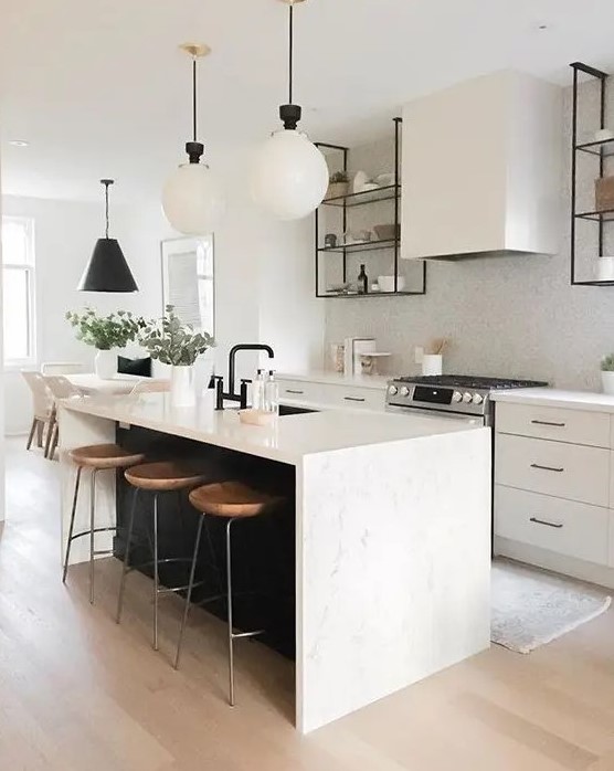 https://www.digsdigs.com/photos/2009/08/a-chic-contemporary-kitchen-with-elegant-white-cabinets-a-white-tile-backsplash-a-black-kitchen-island-with-a-white-stone-countertop-and-pendant-lamps.jpg