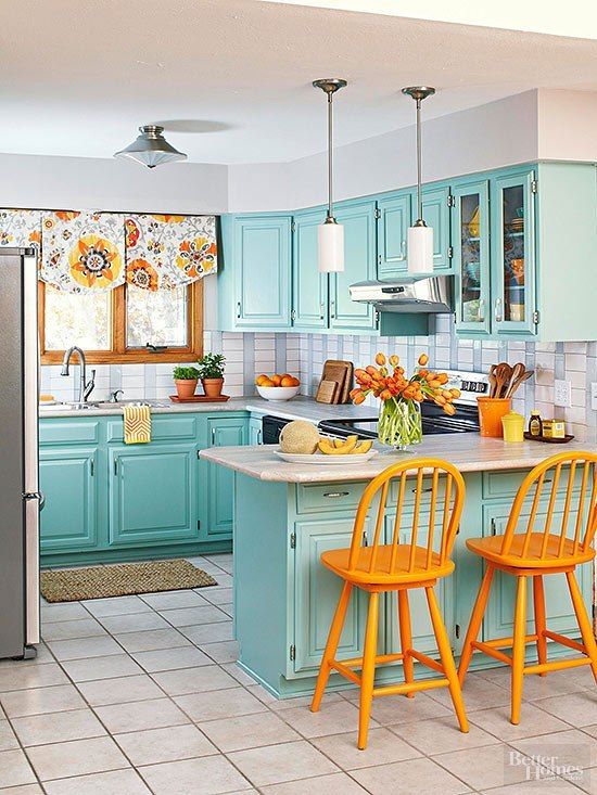 A Bright Blue Kitchen With A Tiled Backsplash Orange Chair Floral Shades And Retro Lamps Is A Very Cool Idea 