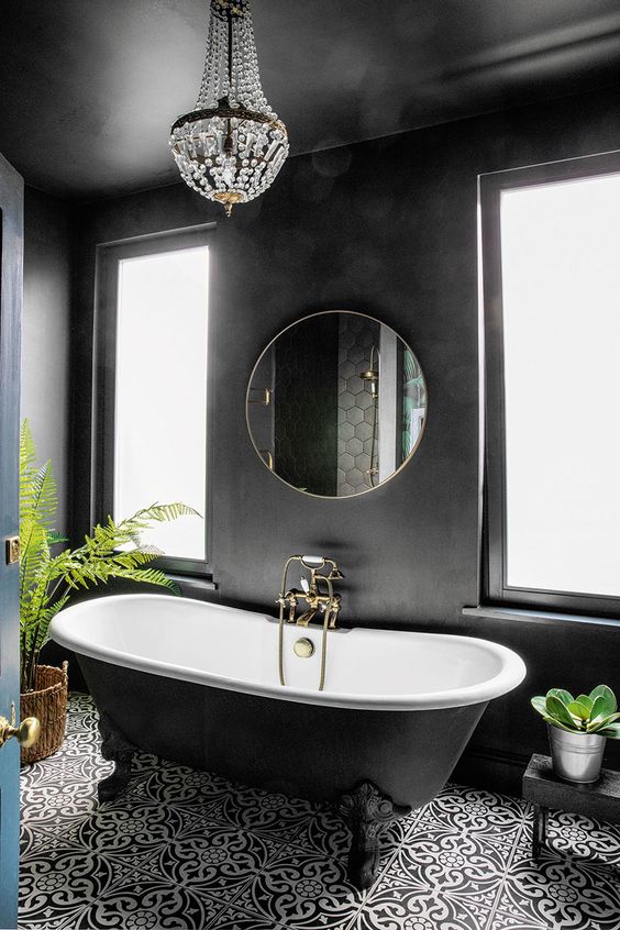 https://www.digsdigs.com/photos/2012/08/a-black-bathroom-with-a-black-and-white-mosaic-tile-floor-a-black-clawfoot-tub-a-crystal-chandelier-and-potted-greenery.jpg
