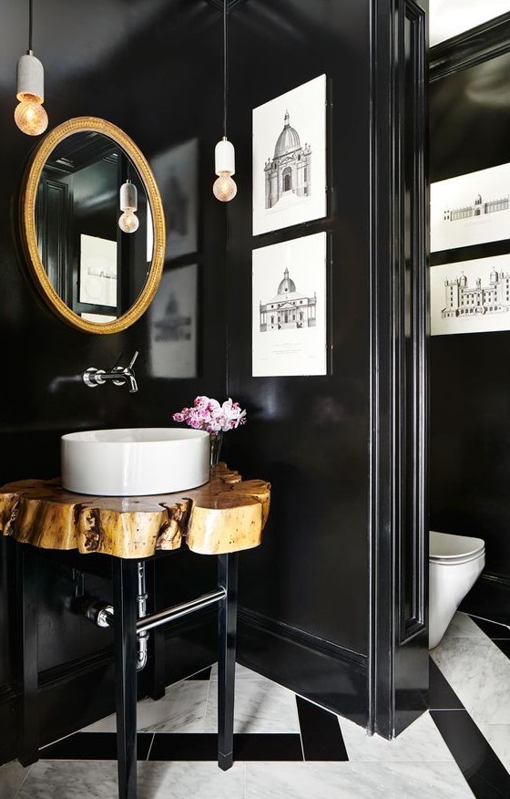 https://www.digsdigs.com/photos/2012/08/a-gorgeous-bathroom-with-a-mosaic-tile-floor-black-walls-a-gold-frame-mirror-a-wood-slice-vanity-and-artworks.jpg