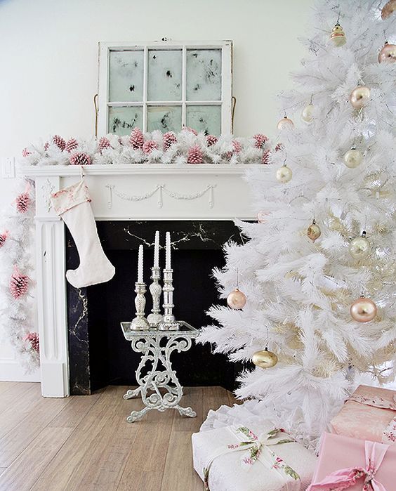 all-white Christmas tree with pastel metallic ornaments looks chic and refined