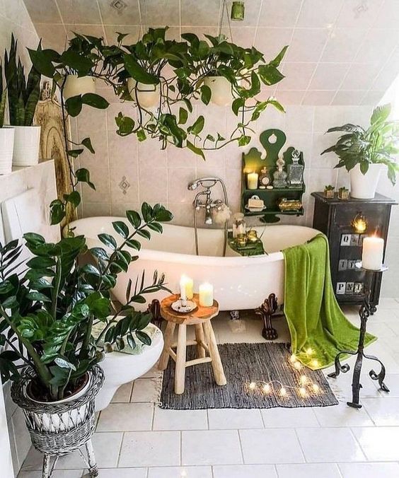 https://www.digsdigs.com/photos/2013/02/a-boho-chic-bathroom-with-a-vintage-tub-some-lights-and-candles-potted-plants-all-around-the-tub-and-suspended.jpg