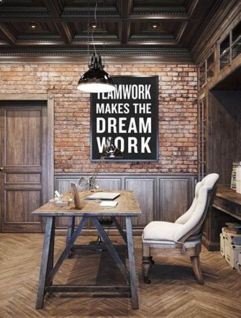 An Industrial Home Office With Brick Walls A Built In Shelving Unit A Wooden Desk And A Comfy Upholstered Chair 