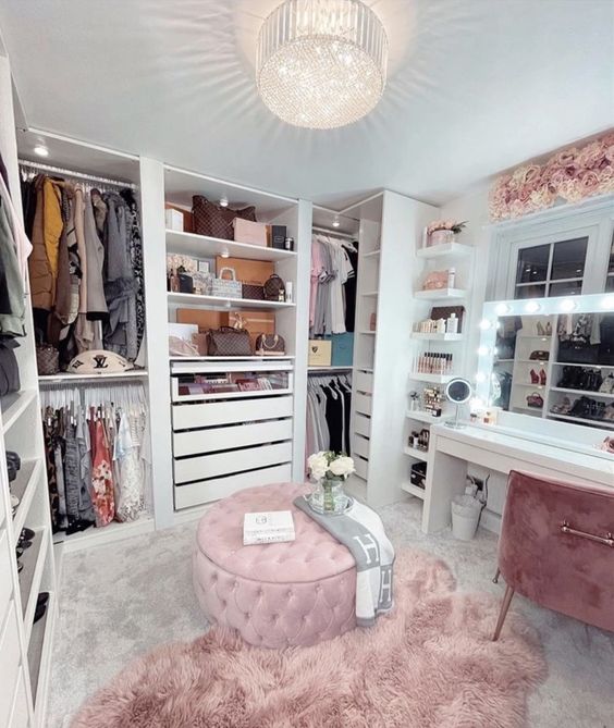 https://www.digsdigs.com/photos/2013/04/a-pretty-glam-feminine-closet-with-open-storage-units-and-drawers-a-pink-pouf-and-rug-a-white-vanity-and-a-pink-chair.jpg