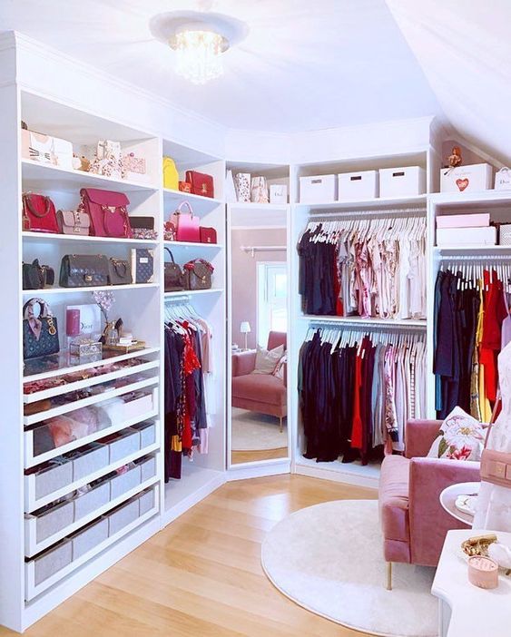 https://www.digsdigs.com/photos/2013/04/a-prety-and-glam-feminine-walk-in-closet-with-open-storage-units-boxes-for-storage-a-full-size-mirror-a-pink-chair-and-a-rug.jpg