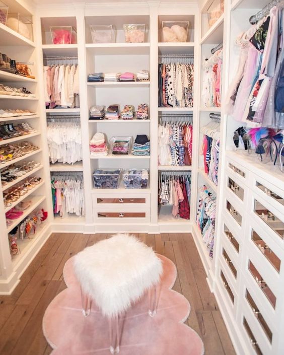 https://www.digsdigs.com/photos/2013/04/a-small-and-glam-closet-with-open-shelves-and-storage-units-drawers-with-mirror-fronts-a-pink-rug-and-a-faux-fur-stool-is-cool.jpg