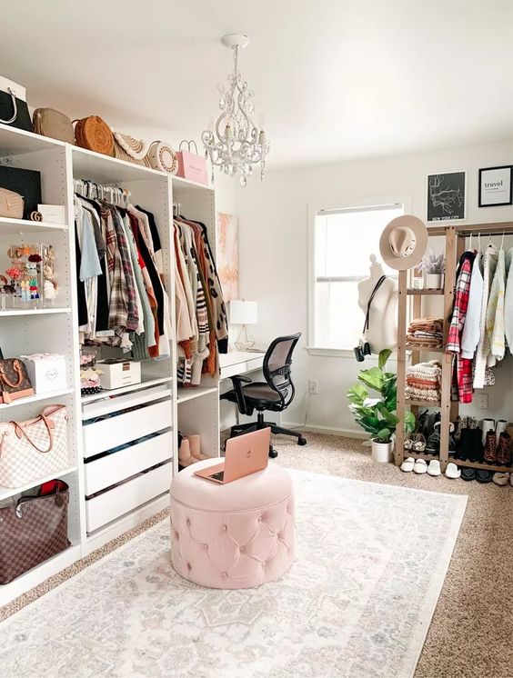 https://www.digsdigs.com/photos/2013/04/a-stylish-cloffice-with-open-storage-units-drawers-and-an-open-storage-rack-a-pink-pouf-a-white-desk-and-a-crystal-chandelier.jpg