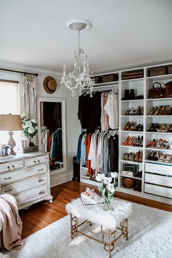 https://www.digsdigs.com/photos/2013/04/a-white-glam-closet-with-open-storage-units-and-drawers-a-shabby-chic-dresser-a-large-mirror-a-crystal-chandelier-a-faux-fur-stool.jpg