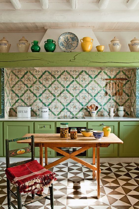 A Bright Boho Vintage Kitchen With Green Cabinets And A Beam A Colorful Tile Backsplash And A Bright Mosaic Floor 