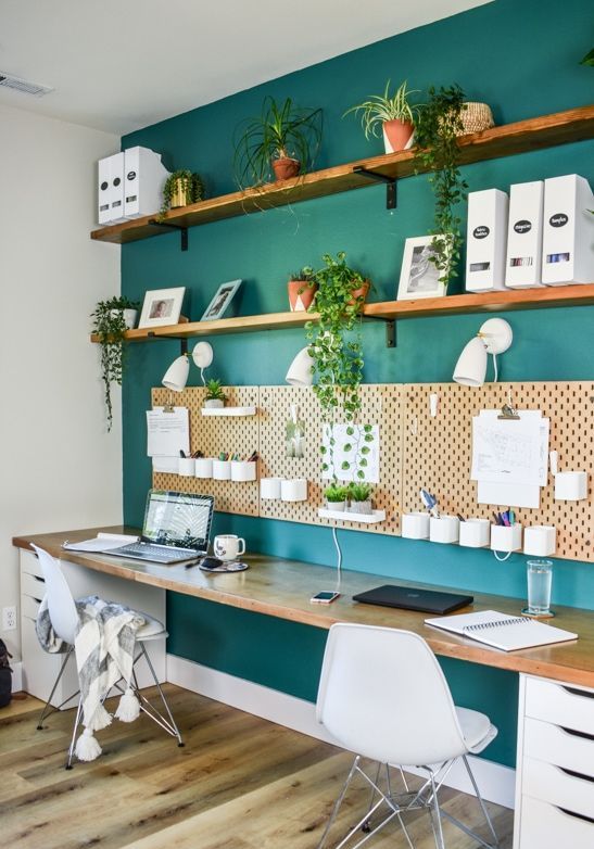 https://www.digsdigs.com/photos/2013/08/a-shared-home-office-with-an-emerald-accent-wall-open-shelves-a-pegboard-a-shared-desk-with-drawers-and-white-Eames-chairs.jpg