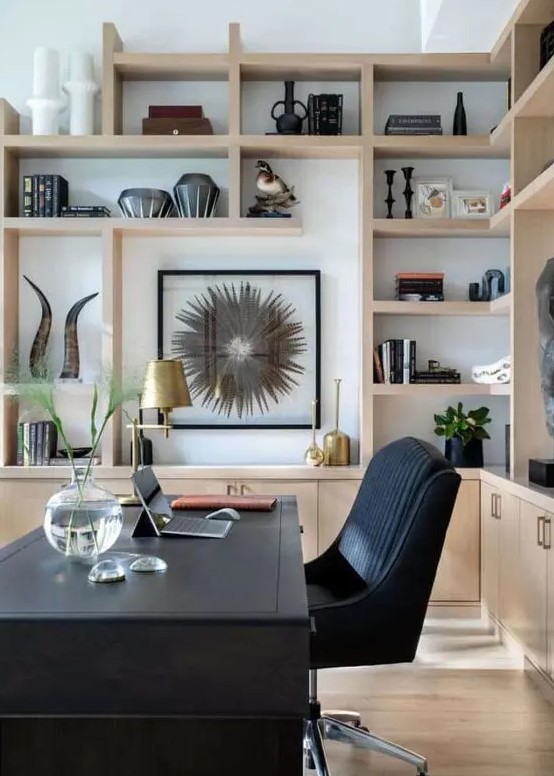 https://www.digsdigs.com/photos/2013/08/a-stylish-home-office-with-a-black-desk-and-a-chair-light-stained-cabinets-and-shelves-gilded-touches-and-artwork.jpg