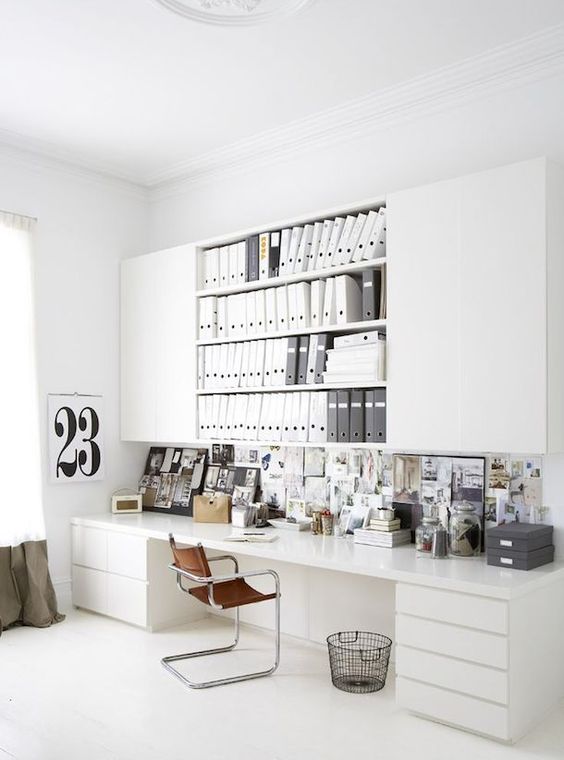 https://www.digsdigs.com/photos/2013/08/a-white-home-office-with-large-sleek-and-open-cabinets-a-large-desk-with-drawers-a-memo-board-is-a-very-practical-space.jpg