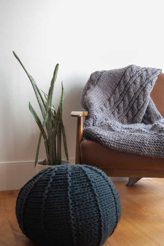 https://www.digsdigs.com/photos/2013/09/a-black-knit-pouf-and-a-grey-knit-blanket-are-a-great-solution-to-cozy-up-your-space-and-make-it-fall-ready.jpg