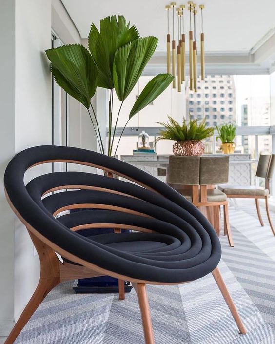 https://www.digsdigs.com/photos/2013/09/a-lovely-black-and-stained-wood-chair-composed-of-many-black-upholstered-circles-is-a-cool-and-smart-idea.jpg