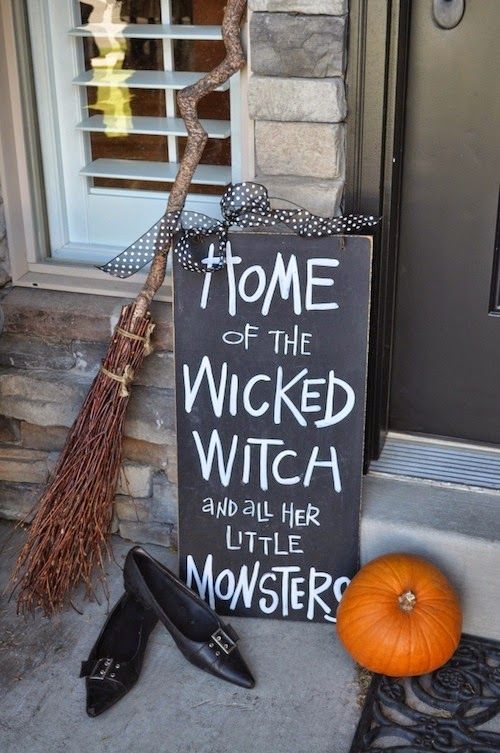 https://www.digsdigs.com/photos/2013/10/easy-front-porch-Halloween-styling-with-a-pumpkin-a-chalkboard-sign-a-broom-and-witches-shoes.jpg