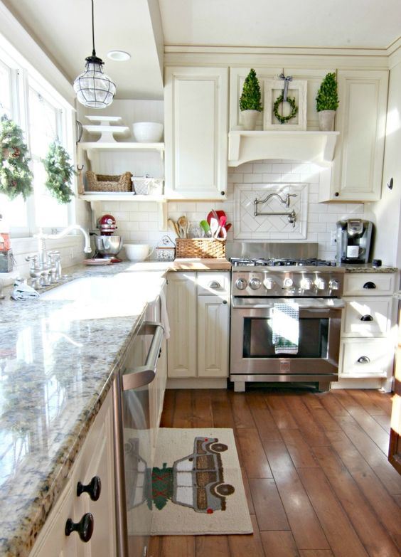 evergreen and pinecone Christmas wreaths, evergreen trees in pots make the kitchen feel like holidays