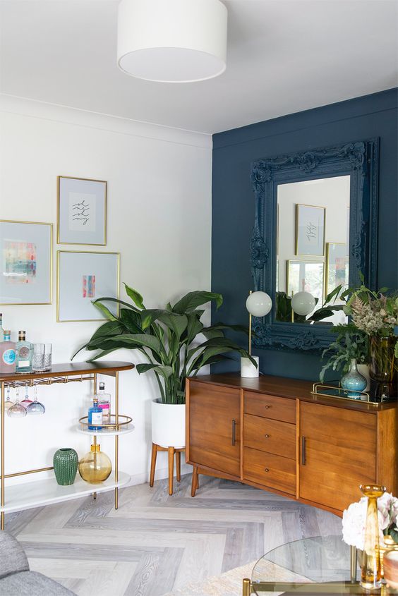 a beautiful rich-stained mid-century modern sideboard with drawers and doors plus small metal handles is a lovely idea