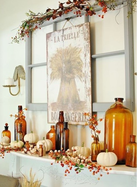 Wall art: old window frame, chicken wire, old bottles and greenery