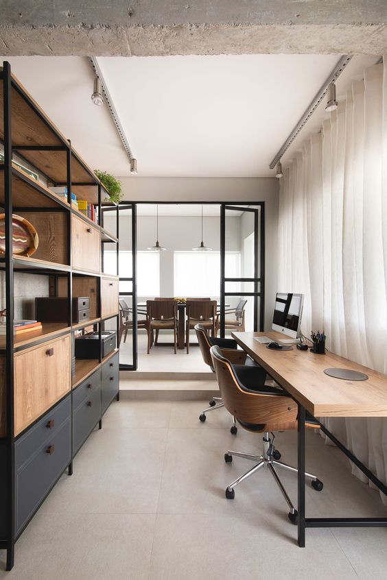 A Contemporary Industrial Home Office With A Large Storage Unit Of Wood And Metal A Stylish Shared Desk And Leather And Plywood Chairs 