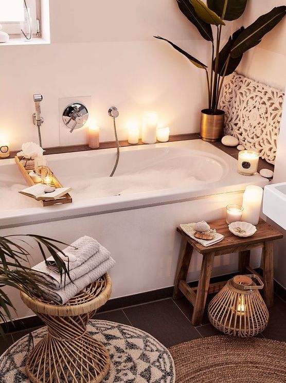 https://www.digsdigs.com/photos/2015/06/a-little-home-spa-bathroom-with-a-tub-candles-and-pebbles-surrounding-it-a-wooden-stool-and-a-candle-lantern.jpg