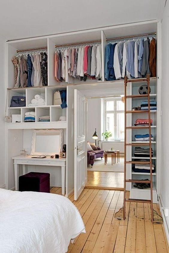 https://www.digsdigs.com/photos/2015/09/a-whole-open-closet-with-lots-of-shelves-is-integrated-over-the-door-and-on-both-sides-to-save-as-much-space-as-possible.jpg