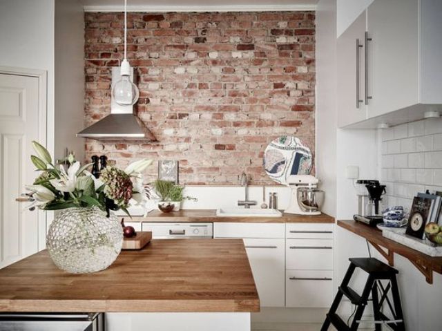 02 Rough Brick Wall Creates A Bold Accent In This Modenr White Kitchen And Makes It Look Cool 