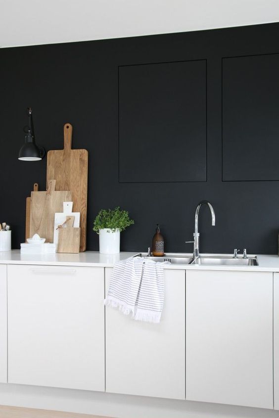 https://www.digsdigs.com/photos/2016/09/26-even-th-emost-minimalist-monochrome-kitchen-with-matte-surfaces-can-be-enlivened-with-herbs-in-pots.jpg