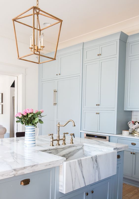 https://www.digsdigs.com/photos/2017/08/02-serenity-blue-kitchen-cabinets-with-white-marble-countertops-and-brass-touches-for-a-retro-look.jpg