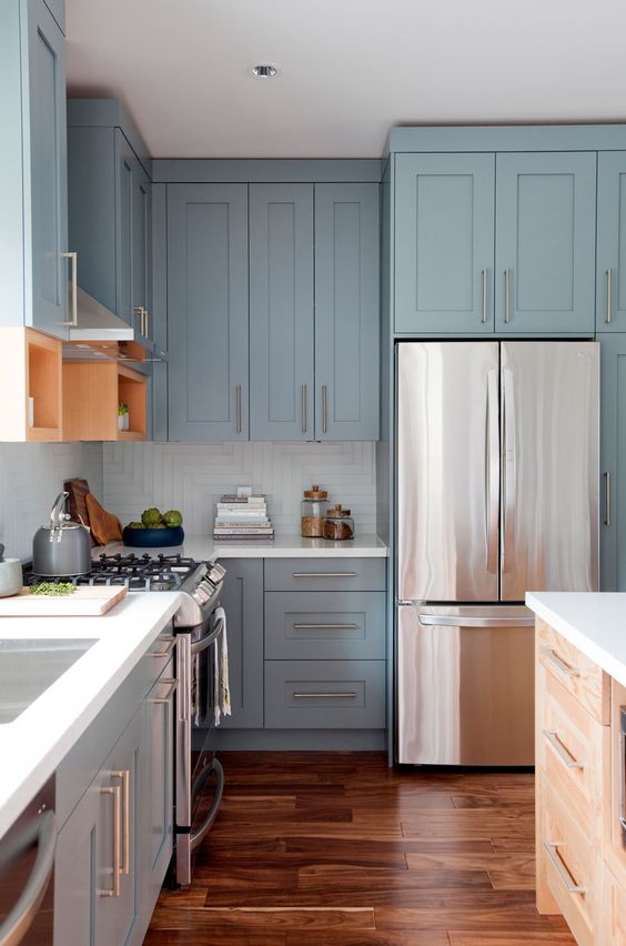 https://www.digsdigs.com/photos/2017/08/04-pale-blue-vintage-kitchen-with-metallic-handles-and-white-countertops.jpg
