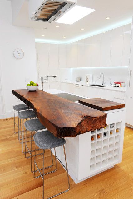 08 A Bold Kitchen Countertop On A Kitchen Island With A Piece Of Raw Edge Wood And Wine Storage 