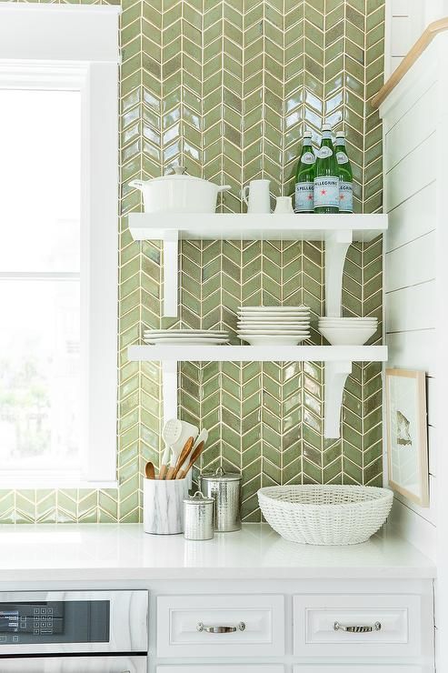 11 White Cabinets Are Paired With White Quartz Countertops And A Ceiling Height Green Herringbone Tiled Backsplash 