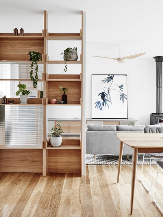 https://www.digsdigs.com/photos/2018/04/08-a-modern-wooden-shelving-unit-features-open-and-box-shaped-shelves-with-much-potted-greenery-for-separating-from-the-dining-room.jpg
