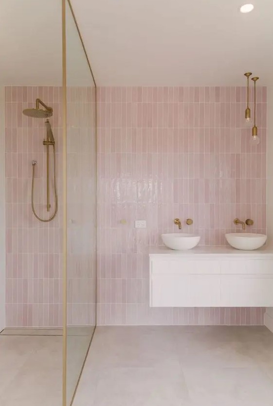 https://www.digsdigs.com/photos/2018/05/a-contemporary-bathroom-with-pink-skinny-tiles-neutral-large-scale-ones-brass-fixtures-and-a-white-floating-vanity.jpg