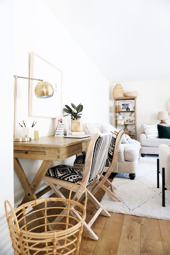 https://www.digsdigs.com/photos/2018/05/a-neutral-farmhouse-living-room-with-grey-seating-furniture-a-coffee-table-a-stained-trestle-table-printed-chairs-some-lovely-boho-decor.jpg