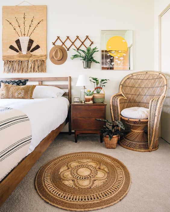 https://www.digsdigs.com/photos/2018/08/02-a-jute-rug-and-artwork-with-jute-a-wicker-chair-ad-some-boho-printed-pillows-for-a-relaxed-boho-space.jpg
