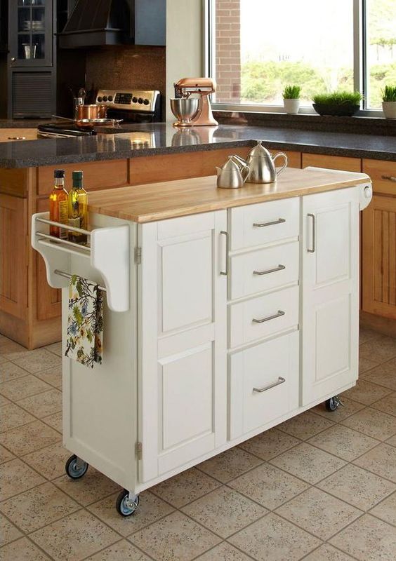 06 A Comfy Mobile Kitchen Island With Many Drawers And Holders Plus A Wooden Countertop 