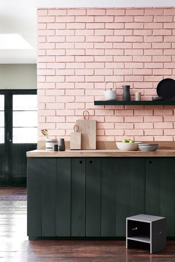 https://www.digsdigs.com/photos/2018/08/07-a-pink-quartz-brick-wall-and-black-wooden-plank-cabinets-make-up-a-stylish-look-with-a-lot-of-texture.jpg