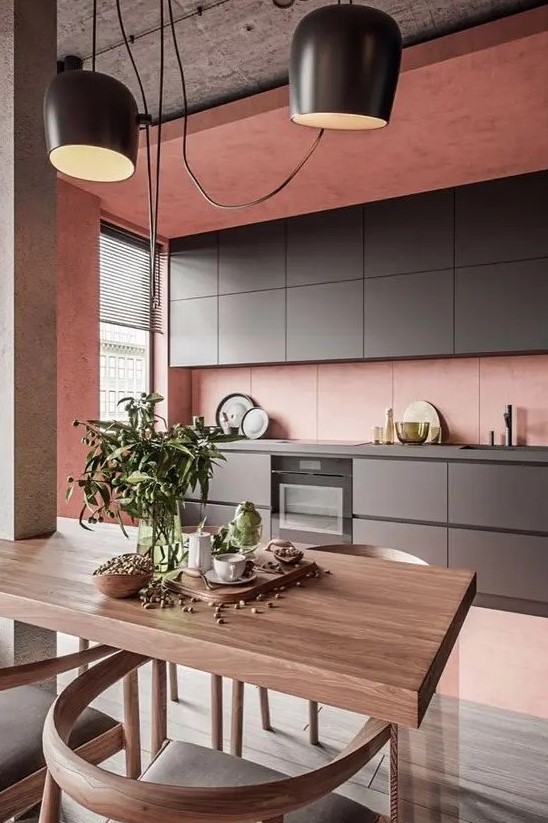 https://www.digsdigs.com/photos/2018/08/a-minimalist-kitchen-in-pink-with-sleek-graphite-grey-cabinetry-a-concrete-ceiling-and-a-small-dining-space.jpg