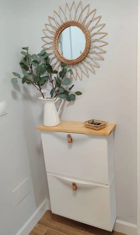 https://www.digsdigs.com/photos/2019/02/a-small-IKEA-Trones-piece-with-leather-pulls-and-a-stained-countertop-is-a-lovely-idea-for-a-small-entryway.jpg