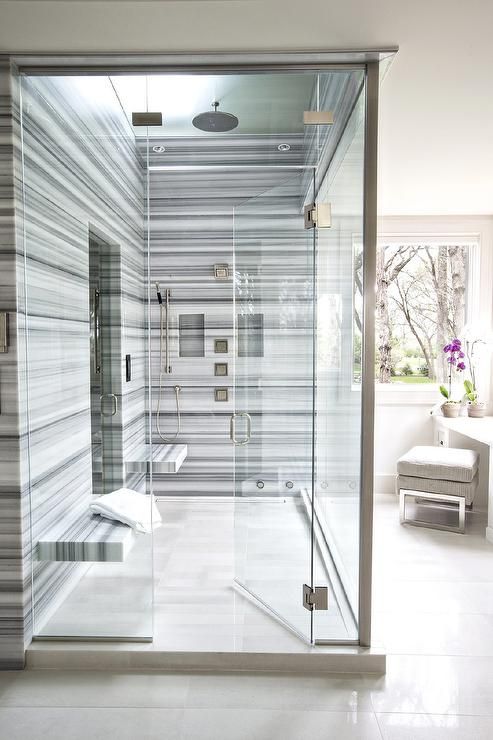 https://www.digsdigs.com/photos/2019/05/a-bold-modern-shower-space-done-with-blue-striped-marble-and-two-floating-benches-that-dont-take-much-space.jpg