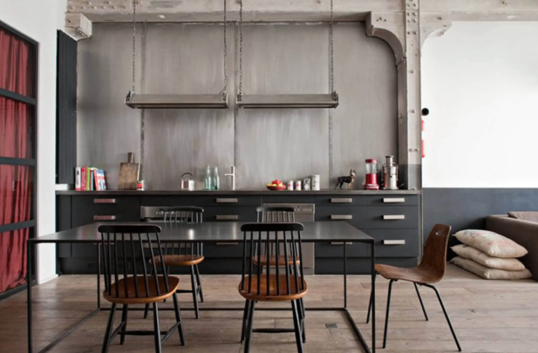 https://www.digsdigs.com/photos/2019/10/22-a-black-industrial-kitchen-made-bolder-with-a-concrete-wall-and-metal-countertops-handles-and-lamps-775x508.png