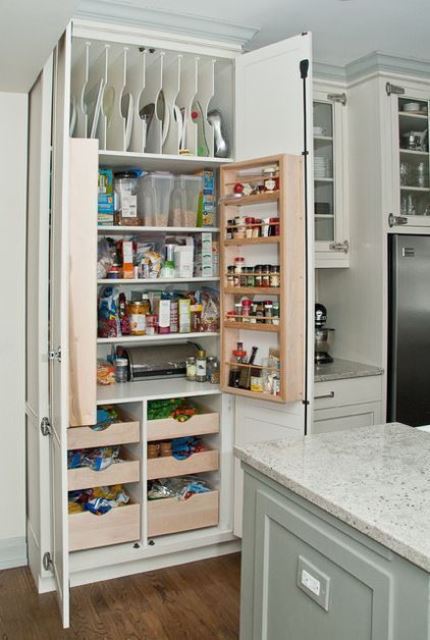 https://www.digsdigs.com/photos/2019/11/02-a-neutral-kitchen-with-a-built-in-pantry-with-lots-of-various-shelves-and-drawers-to-store-everything-you-may-need.jpg