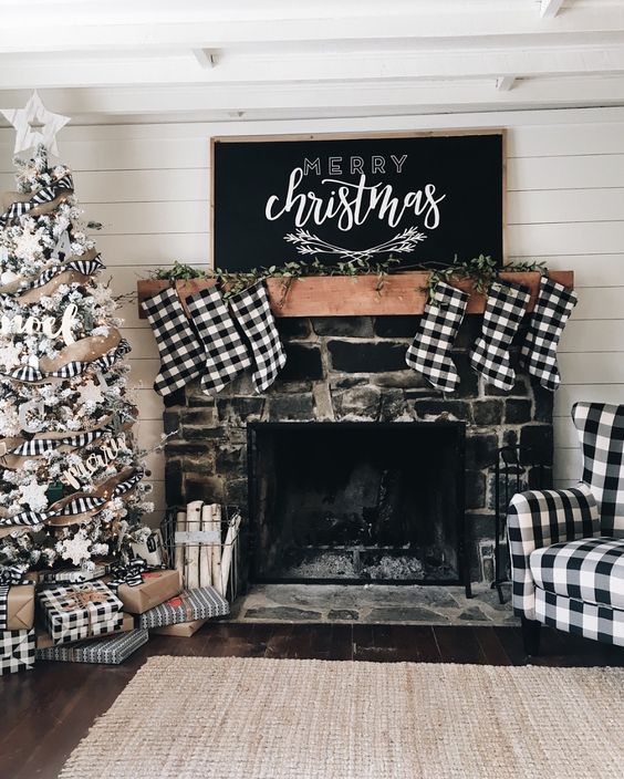https://www.digsdigs.com/photos/2019/12/21-buffalo-check-stockings-a-chair-a-ribbon-on-the-tree-and-gift-boxes-to-make-the-space-look-vintage-and-Christmassy.jpg