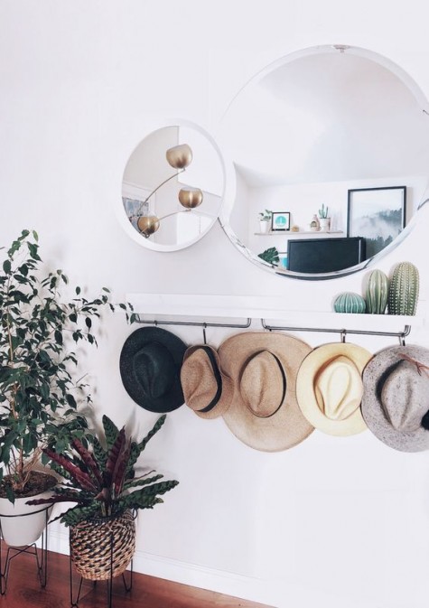 https://www.digsdigs.com/photos/2019/12/23-an-IKEA-Mosslanda-shelf-or-sleek-console-with-hat-holders-is-an-ultimate-piece-for-a-contemporary-or-boho-entryway.jpg