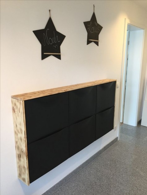 https://www.digsdigs.com/photos/2019/12/25-an-IKEa-Trones-cabinet-in-black-with-a-light-colored-waterfall-wooden-countertop-is-a-contemporary-or-minimalist-idea.jpg